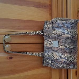 Sofia Vergara faux snakeskin purse